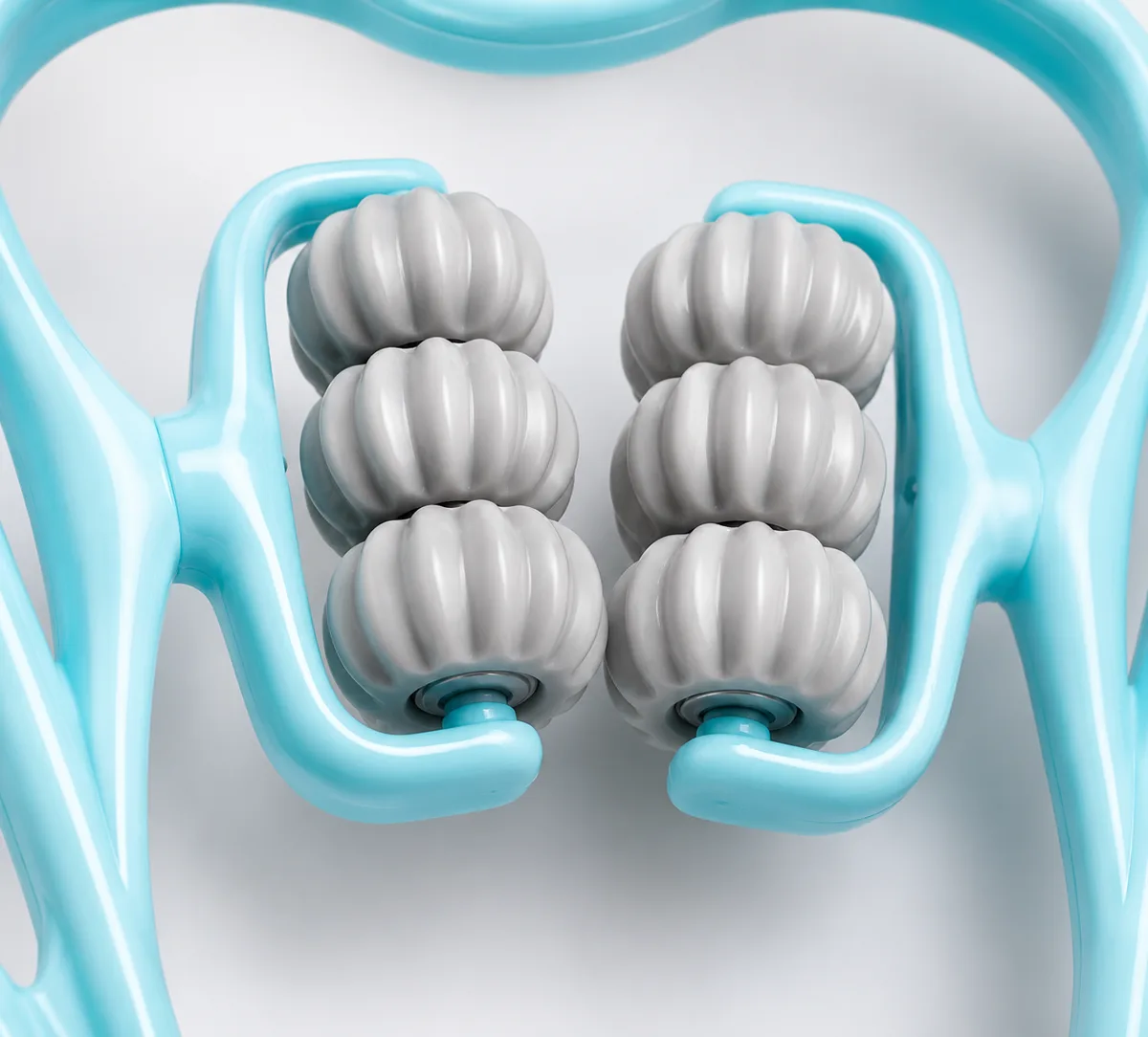 Close-up of the six grooved rollers, arranged in two columns of three
